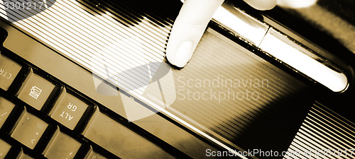Image of Working at laptop .