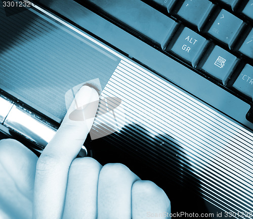 Image of Working at laptop .