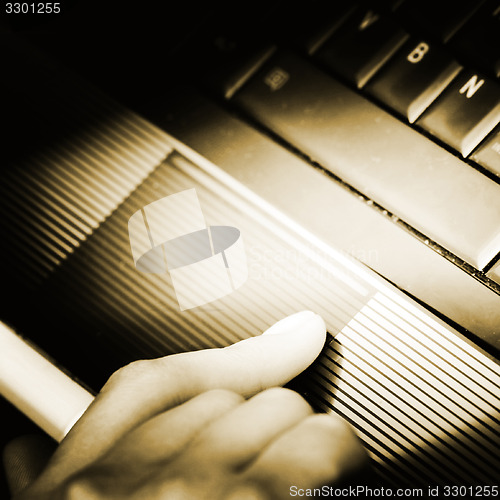 Image of Working at laptop .