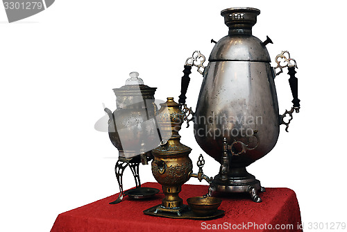 Image of three old Russian samovar on a white background