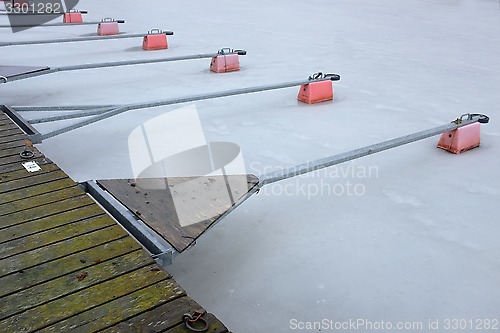 Image of empty boat park on the lake in winter 