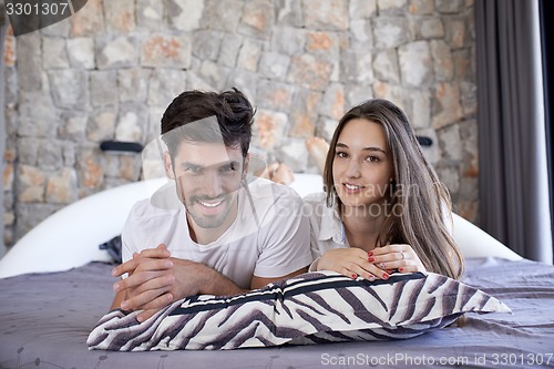 Image of couple relax and have fun in bed