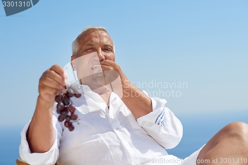 Image of senior man sitting outside