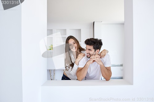 Image of relaxed young couple at home staircase