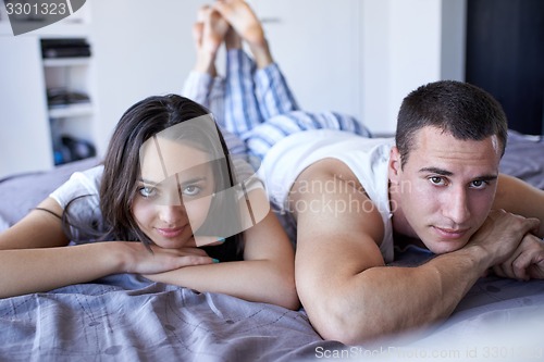 Image of couple relax and have fun in bed