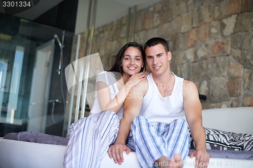 Image of couple relax and have fun in bed