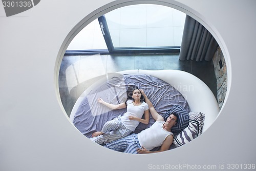 Image of couple relax and have fun in bed