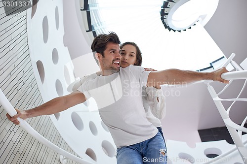 Image of relaxed yung couple at home  stairs