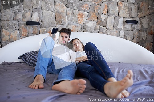 Image of couple relax and have fun in bed