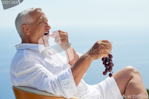 Image of senior man sitting outside