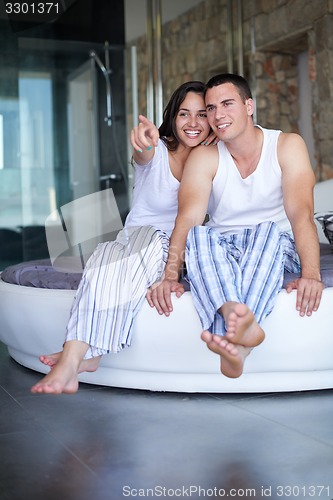 Image of couple relax and have fun in bed