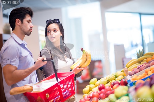 Image of couple shopping in a supermarket