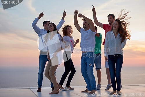 Image of party people  on sunset