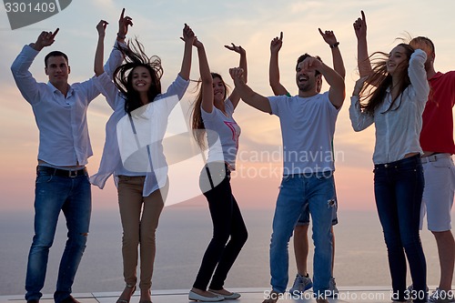 Image of party people  on sunset