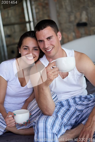 Image of couple relax and have fun in bed