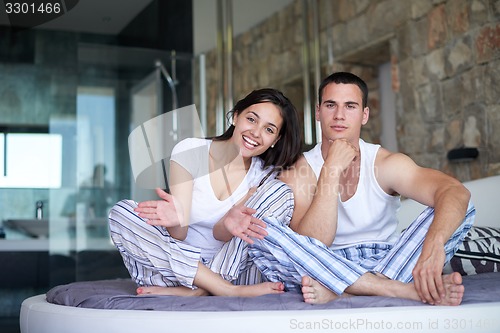 Image of couple relax and have fun in bed