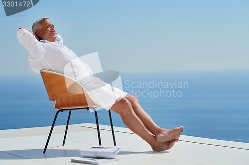 Image of senior man sitting outside