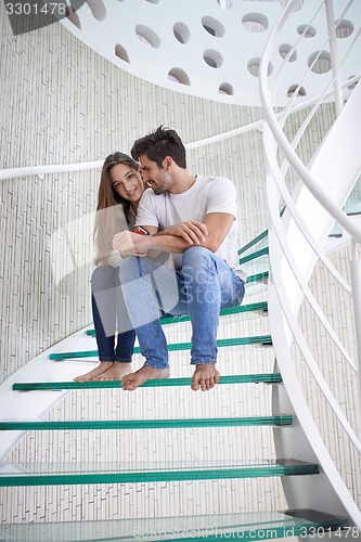 Image of relaxed yung couple at home  stairs