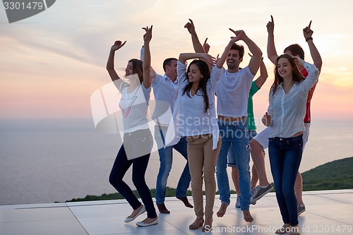 Image of party people  on sunset