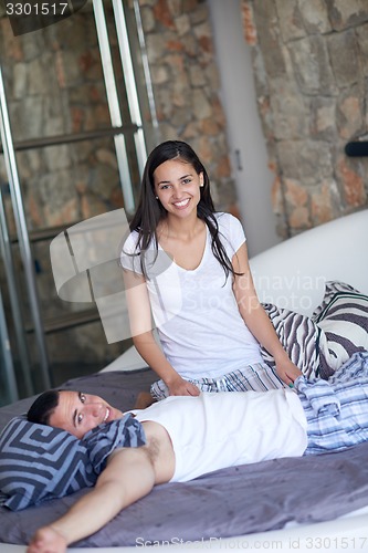 Image of couple relax and have fun in bed