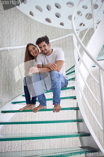 Image of relaxed yung couple at home  stairs