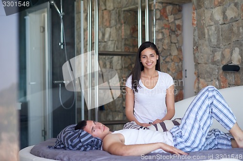 Image of couple relax and have fun in bed