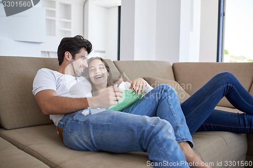 Image of couple at modern home using tablet computer