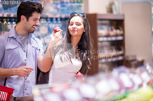 Image of couple shopping in a supermarket