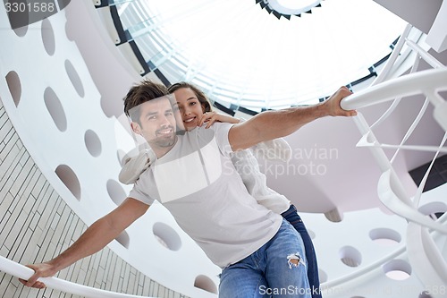 Image of relaxed yung couple at home  stairs