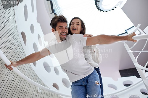 Image of relaxed yung couple at home  stairs