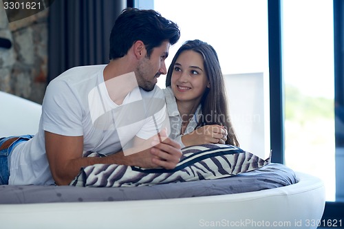 Image of couple relax and have fun in bed