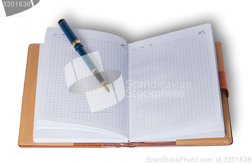 Image of Fountain pen on top of a notebook