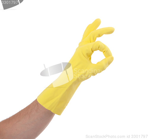 Image of Hand gesturing with yellow cleaning product glove