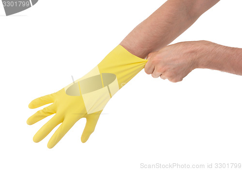 Image of Hand in yellow glove