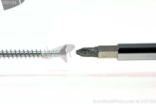 Image of screwdriver and screw