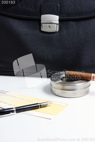 Image of cigar and business