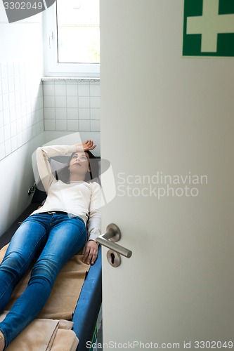 Image of Young woman is relaxing in a quiet room of an office