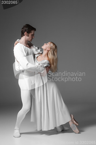 Image of Two young ballet dancers practicing. attractive dancing performers  in white 