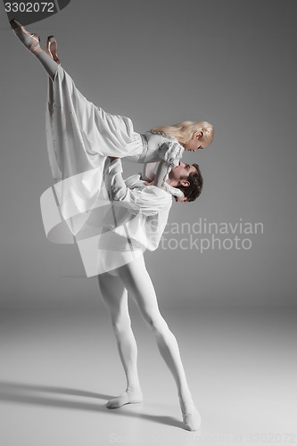 Image of Two young ballet dancers practicing. attractive dancing performers  in white 
