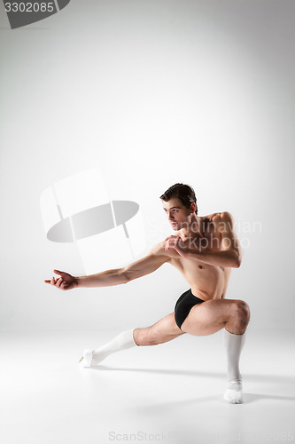 Image of The young attractive modern ballet dancer on white background