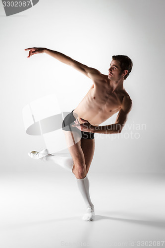 Image of The young attractive modern ballet dancer on white background