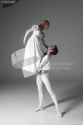 Image of Two young ballet dancers practicing. attractive dancing performers  in white 