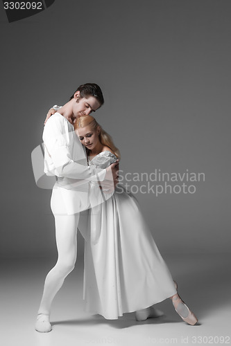 Image of Two young ballet dancers practicing. attractive dancing performers  in white 