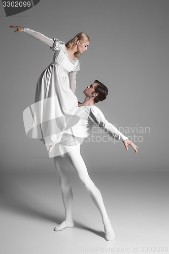 Image of Two young ballet dancers practicing. attractive dancing performers  in white 