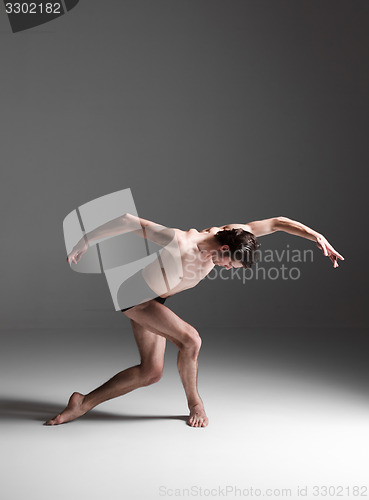 Image of The young attractive modern ballet dancer on white background