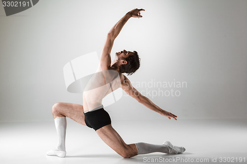 Image of The young attractive modern ballet dancer on white background