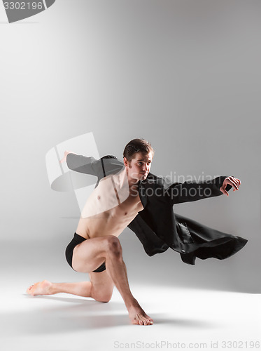 Image of The young attractive modern ballet dancer on white background