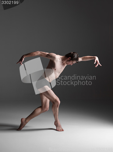 Image of The young attractive modern ballet dancer on white background