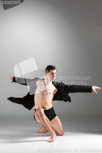 Image of The young attractive modern ballet dancer on white background