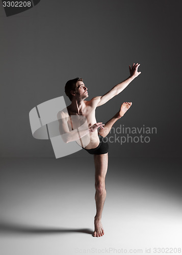 Image of The young attractive modern ballet dancer on white background